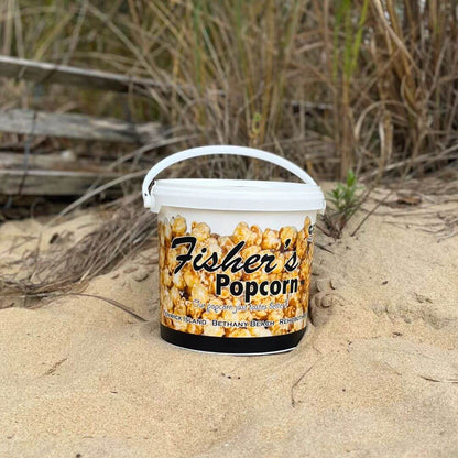 Fisher's Popcorn caramel popcorn tub, 1.2-gallon size, in a classic branded popcorn tub with caramel-coated popcorn inside.