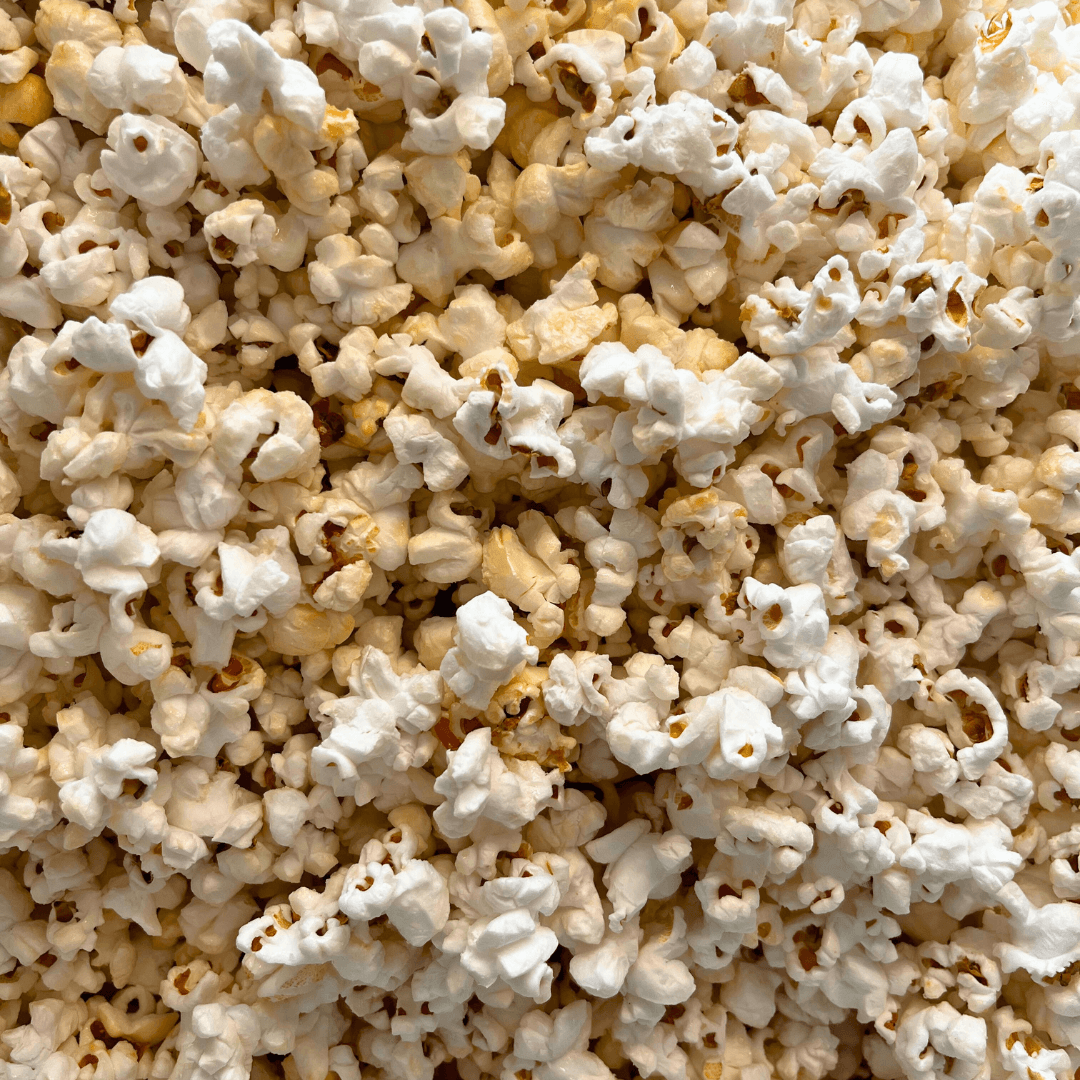 Fisher’s Popcorn tub filled with caramel popcorn, 1.2-gallon size, featuring the Fisher's Popcorn brand label.