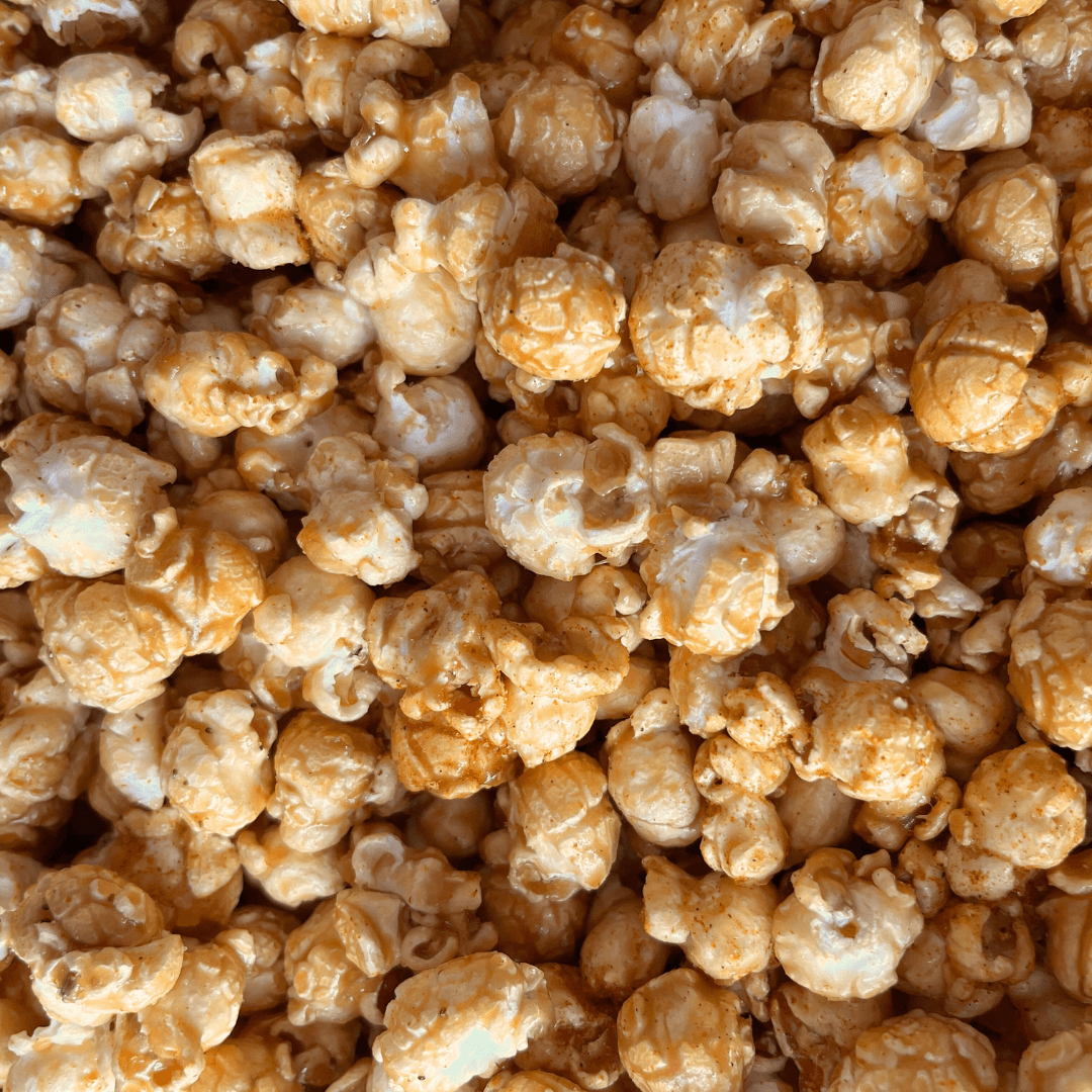 Fisher’s Popcorn caramel popcorn in a 1.2-gallon popcorn tub, featuring a classic Fisher's Popcorn branded container.