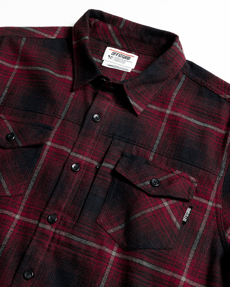 Black Destroyer Flannel by Off The Grid Surplus, shown in a close-up of the soft, plaid fabric with a button-up design.