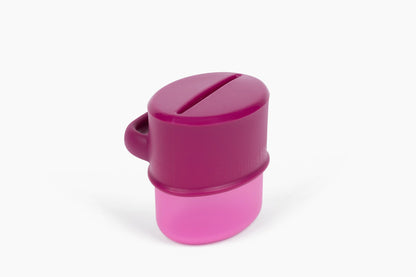 Flipping Holder KiddyTrek 4-in-1 nursing and feeding set with raspberry food pouch, juice box holder, snack cup, and sip cup in one.