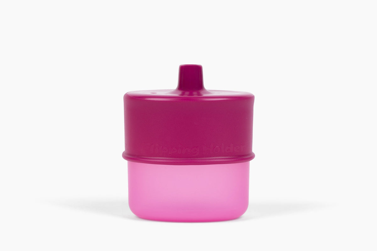 Flipping Holder KiddyTrek 4-in-1 nursing and feeding set with raspberry food pouch, juice box holder, snack cup, and sip cup.