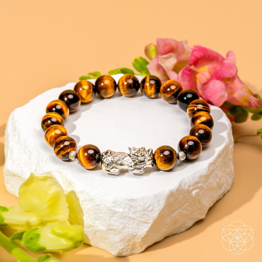 Tiger’s Eye and Pixiu bracelet from Conscious Items featuring a woven design with beaded accents.