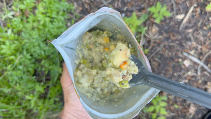 Single pouch of FOUNDATION Outdoors Chicken Pot Pie Meal showing a ready-to-eat, hearty chicken and vegetable filling in a convenient meal pouch.