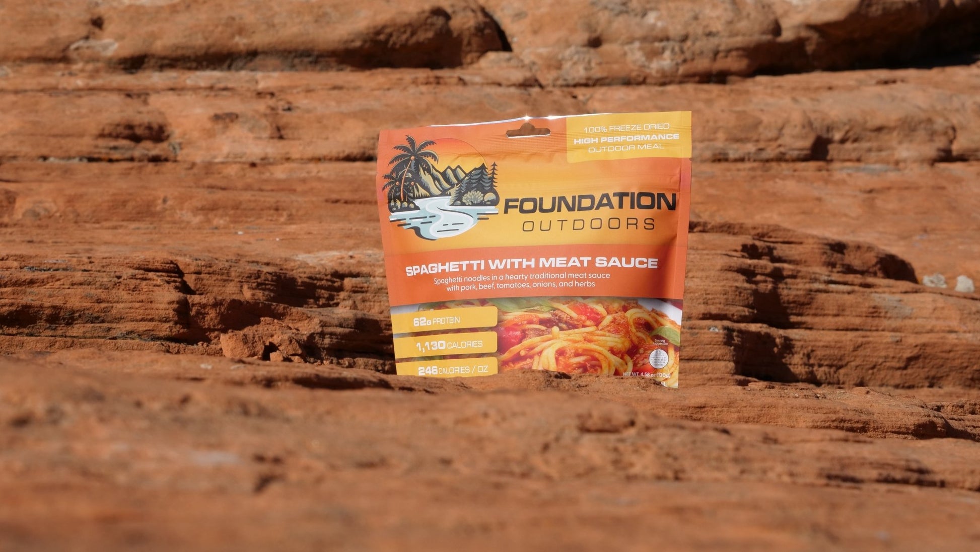 Single pouch of FOUNDATION Outdoors spaghetti with meat sauce meal, showing the prepared dish in a biodegradable pouch.
