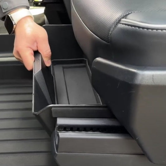 Cybertruck front under-seat storage box by Tesery, showing a secure, organized storage compartment inside the vehicle.