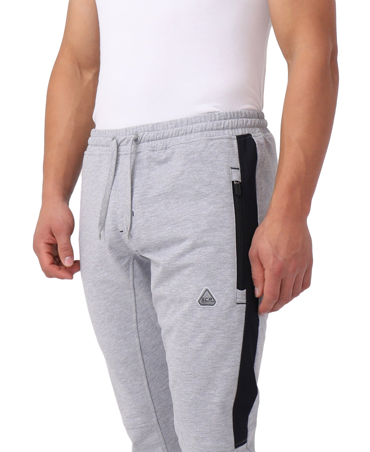 Close-up of SCR Sportswear Infinite Flex Tall Fit men's joggers sweatpants, showing front fabric and fit details.