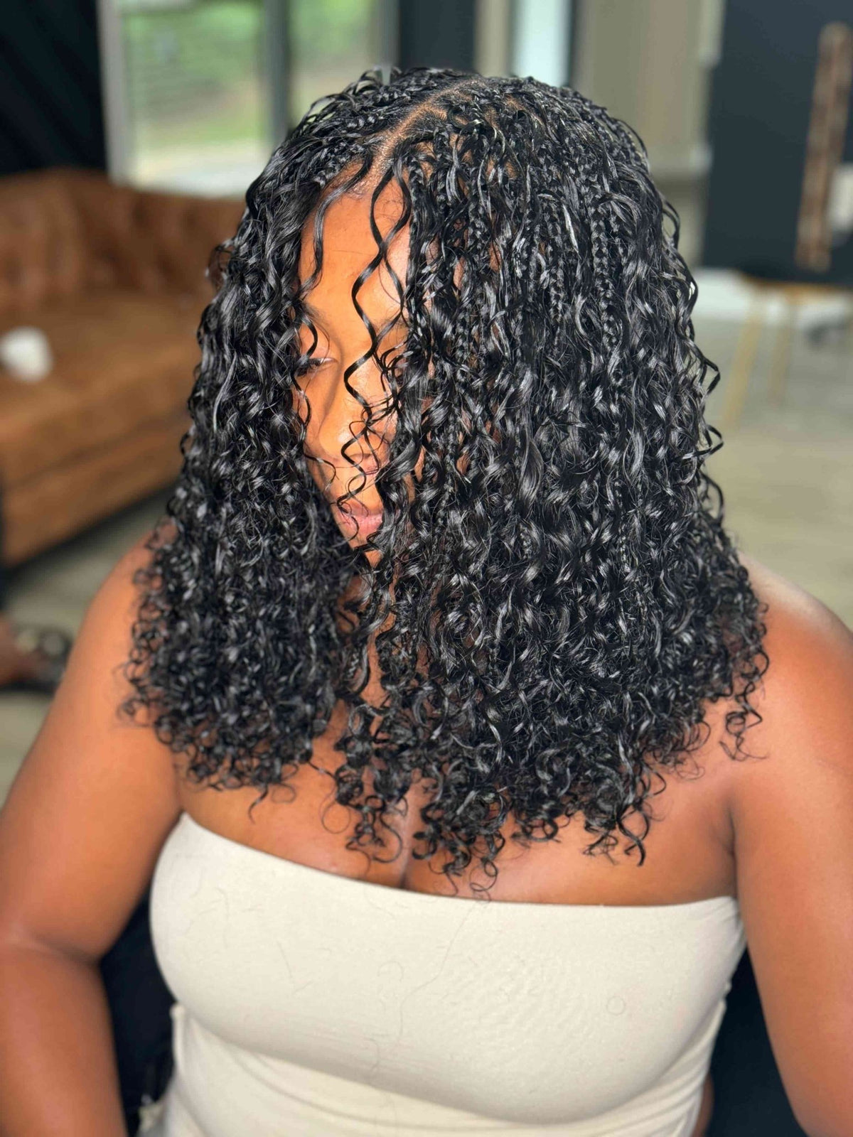 Deep Wave Boho Hair in natural black from Fula Beauty, showcasing lush, wavy hair with a deep wave texture.
