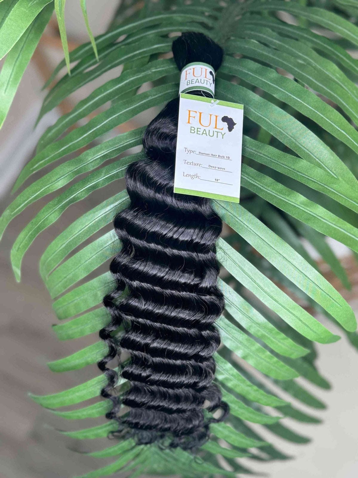 Fula Beauty Deep Wave Boho Hair in natural black, 12-inch length, showcasing soft, wavy textured hair.