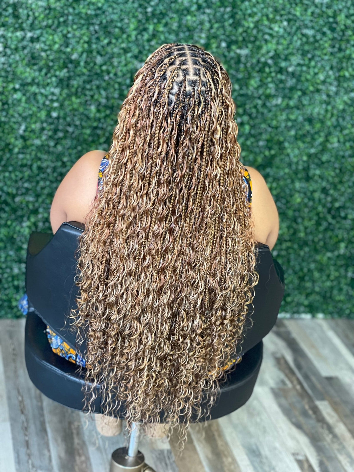 Fula Beauty Deep Wave Boho Hair in natural black, 12-inch length with wavy texture, showcased on a model.