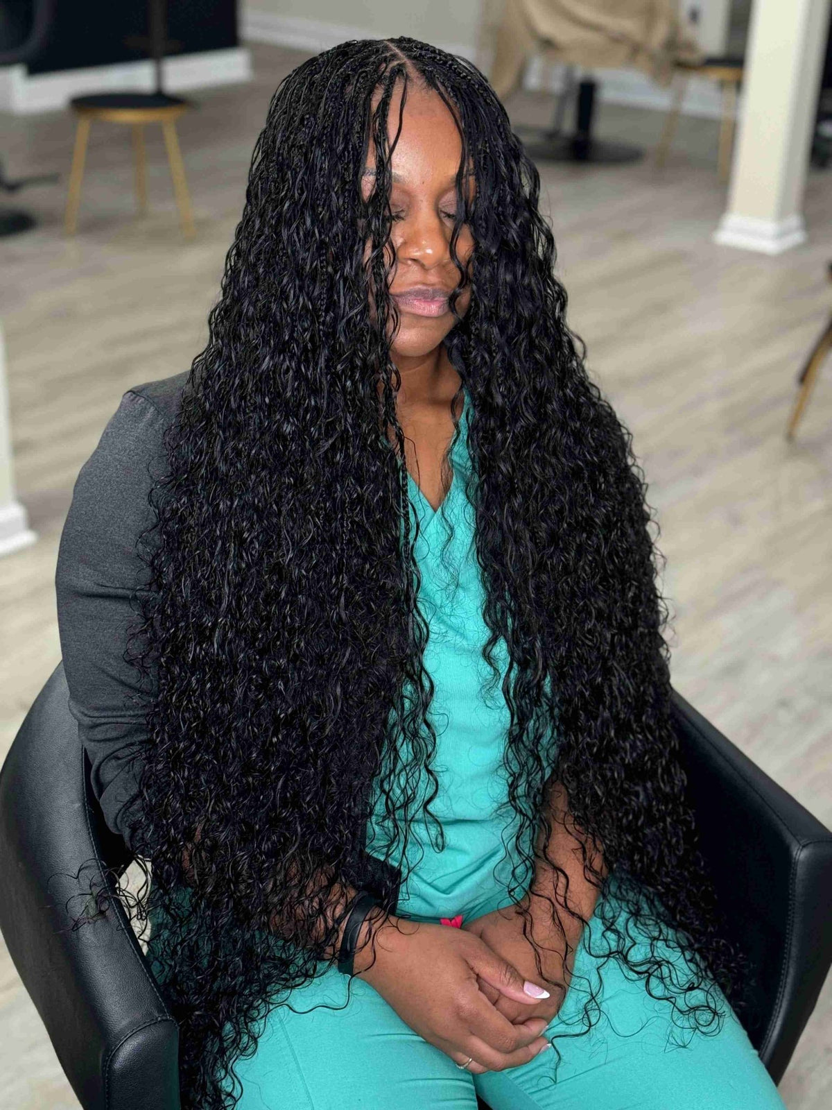 Natural black Italian Curl boho hair extension by Fula Beauty showcasing soft, voluminous curls on a model.