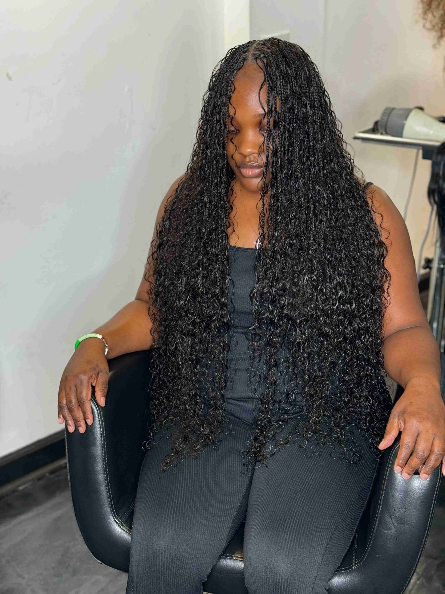 Natural black Italian Curl boho hair extension by Fula Beauty with voluminous, defined curls in a 1B shade.