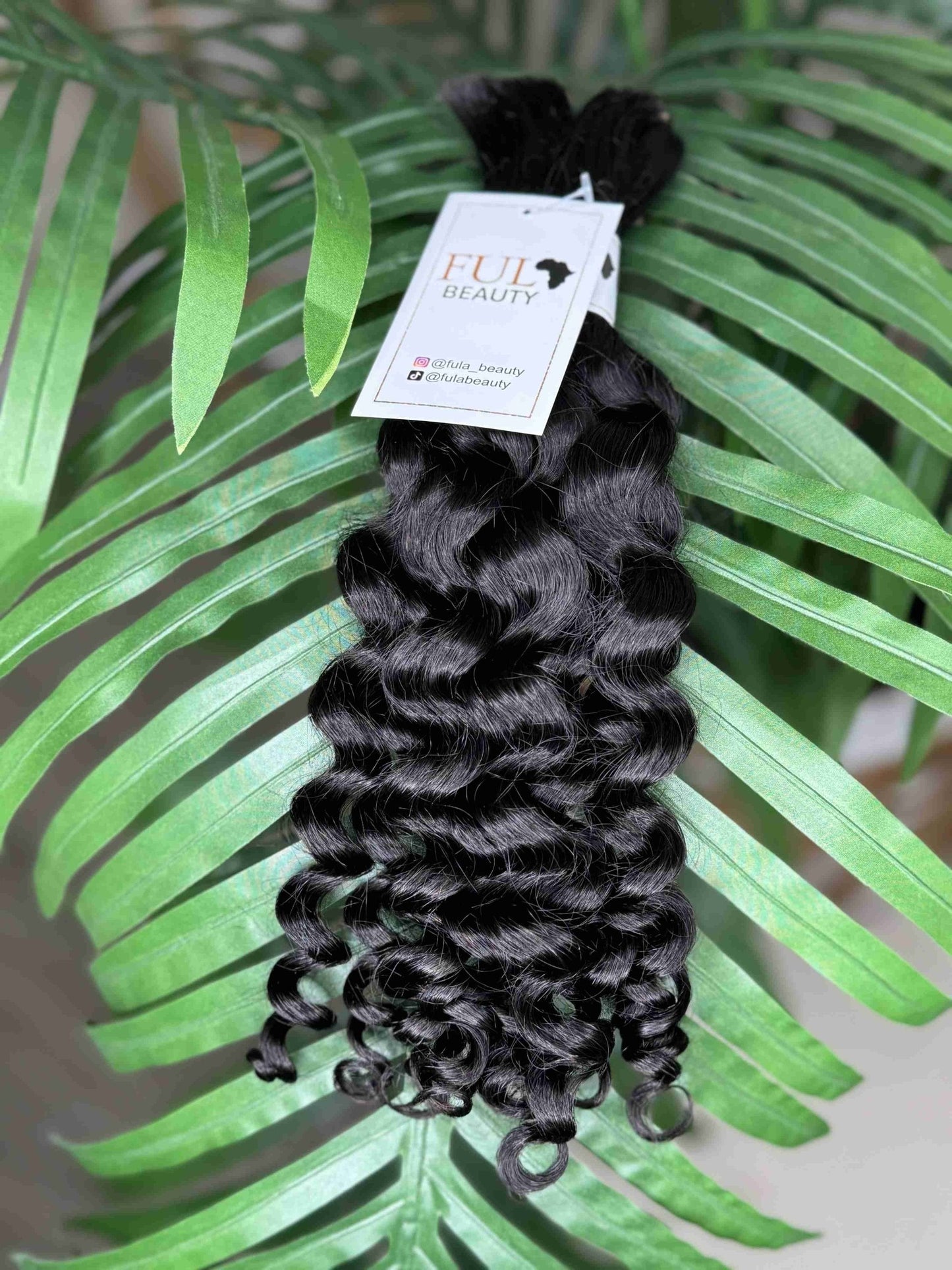 Natural black Italian Curl boho hair extension by Fula Beauty showcasing soft, defined curls with a natural texture.