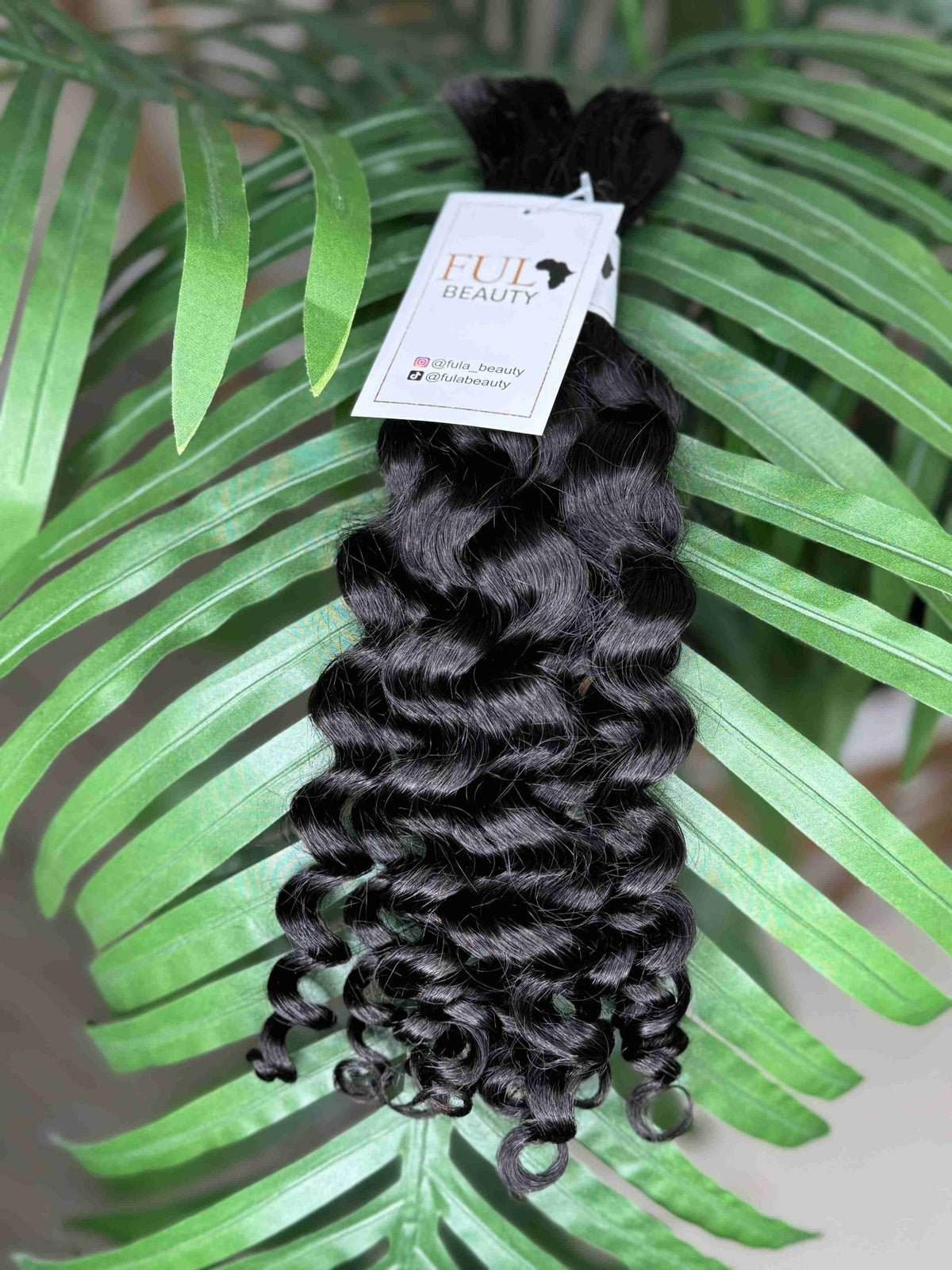 Natural black Italian Curl boho hair extension by Fula Beauty showcasing soft, defined curls with a natural texture.