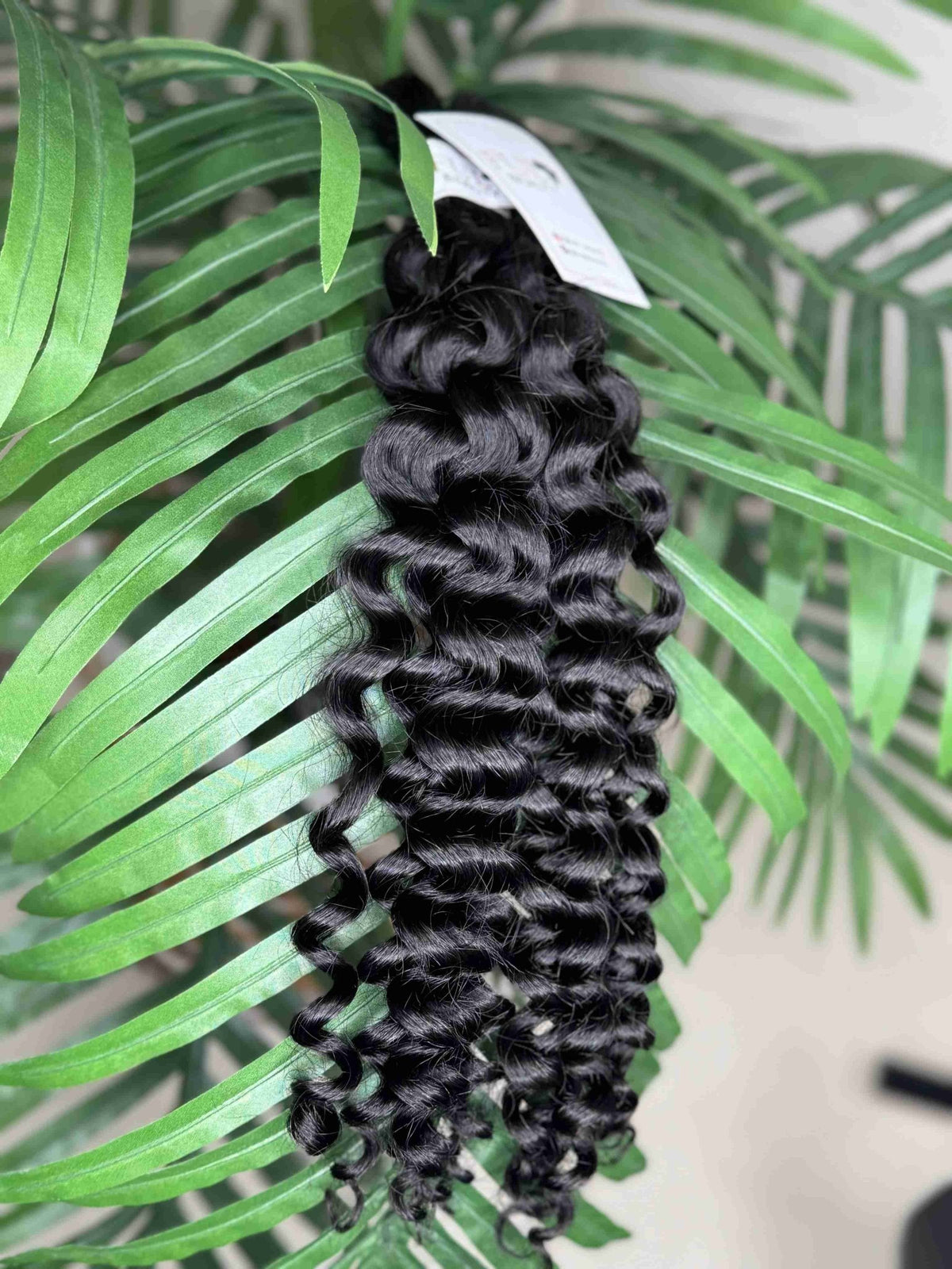 Fula Beauty Italian Curl boho hair in natural black with soft, defined curls, showcasing a stylish hairdo.