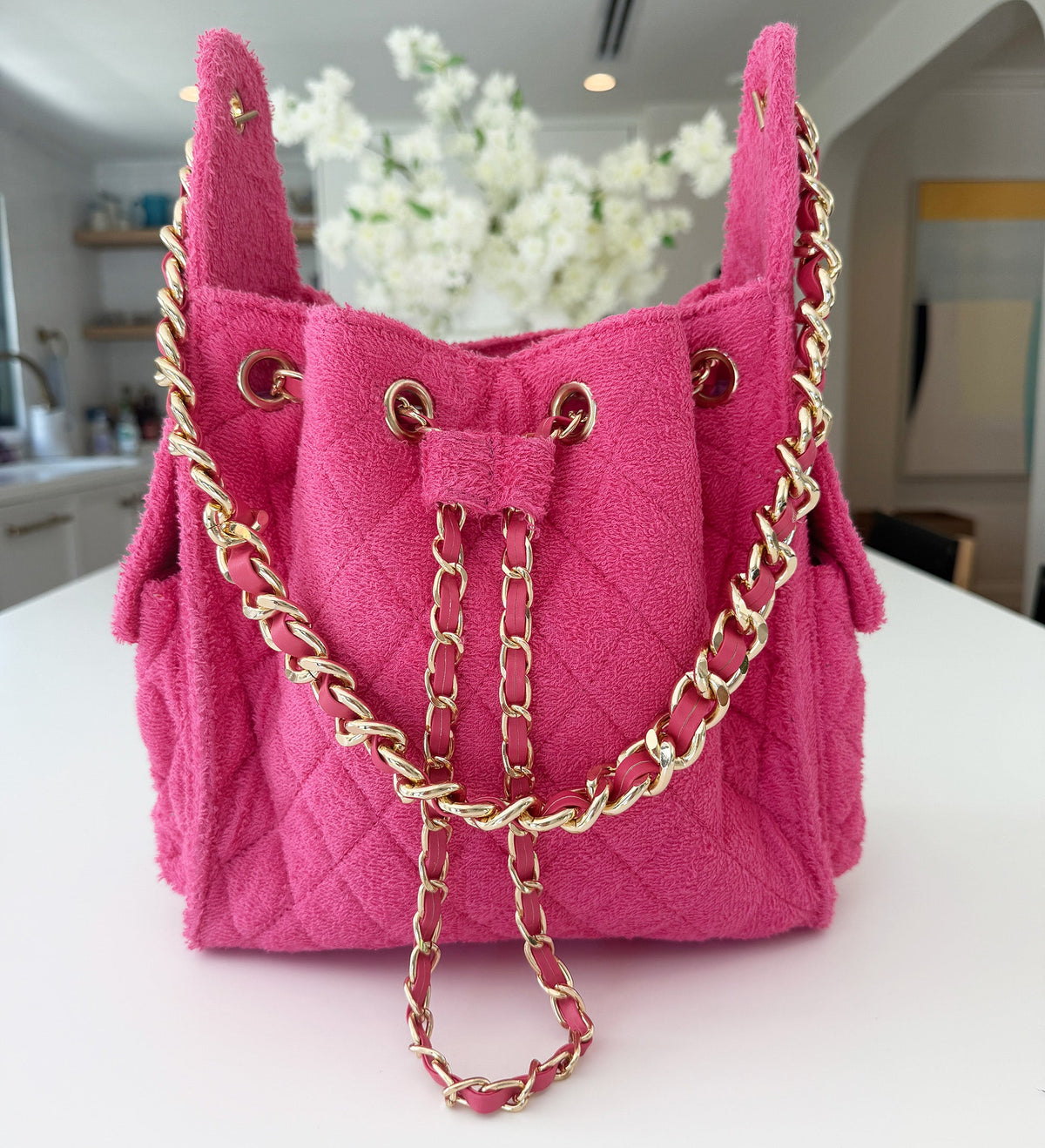 Small fuchsia Bayshore Bucket by BEACH HAUS with a vibrant color and sturdy handle, perfect for beach or outdoor use.