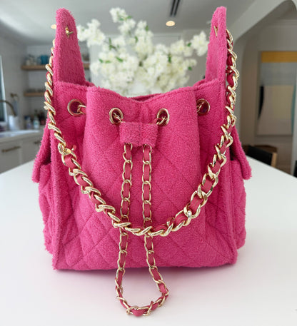 Small fuchsia Bayshore Bucket by BEACH HAUS with a vibrant color and sturdy handle, perfect for beach or outdoor use.