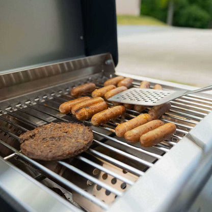Stainless G22 tabletop propane gas grill by Monument Grills with side handles and cooking grate for outdoor grilling.