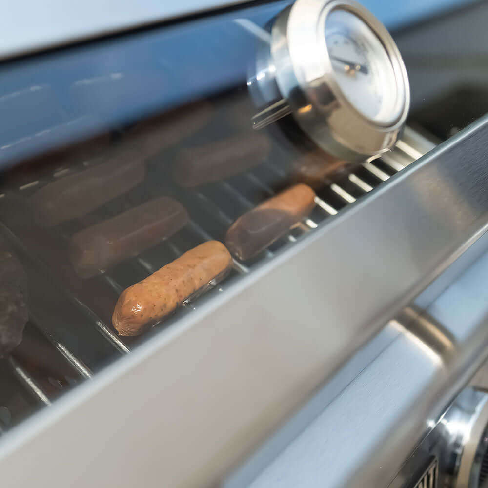 Stainless G22 tabletop propane gas grill by Monument Grills with cooking grates and control knobs for outdoor grilling.