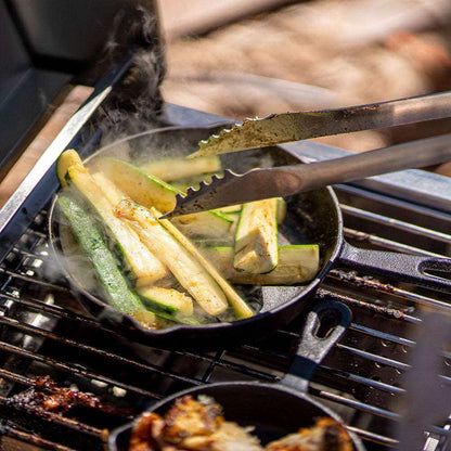 Stainless G22 Monument Grills tabletop propane gas grill with cooking grate and control knobs, ideal for outdoor grilling.