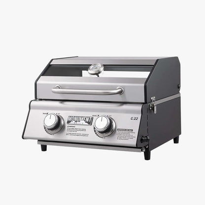 Stainless G22 Monument Grills tabletop propane gas grill with cooking surface and control knobs, ideal for outdoor grilling.