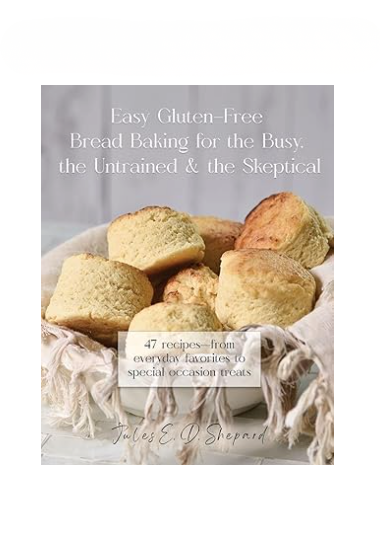 Print book titled "Easy Gluten Free Bread Baking for the Busy, the Untrained, and the Skeptical" by gfJules, showing the cover with baking images.