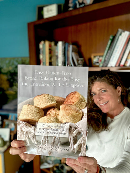 Print book titled "Easy Gluten Free Bread Baking" by gfJules, featuring a colorful cover with bread images and baking tools.