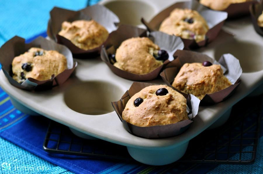 Pack of gfJules gluten-free muffin mix in a resealable bag, showcasing the product label and fresh muffin ingredients.