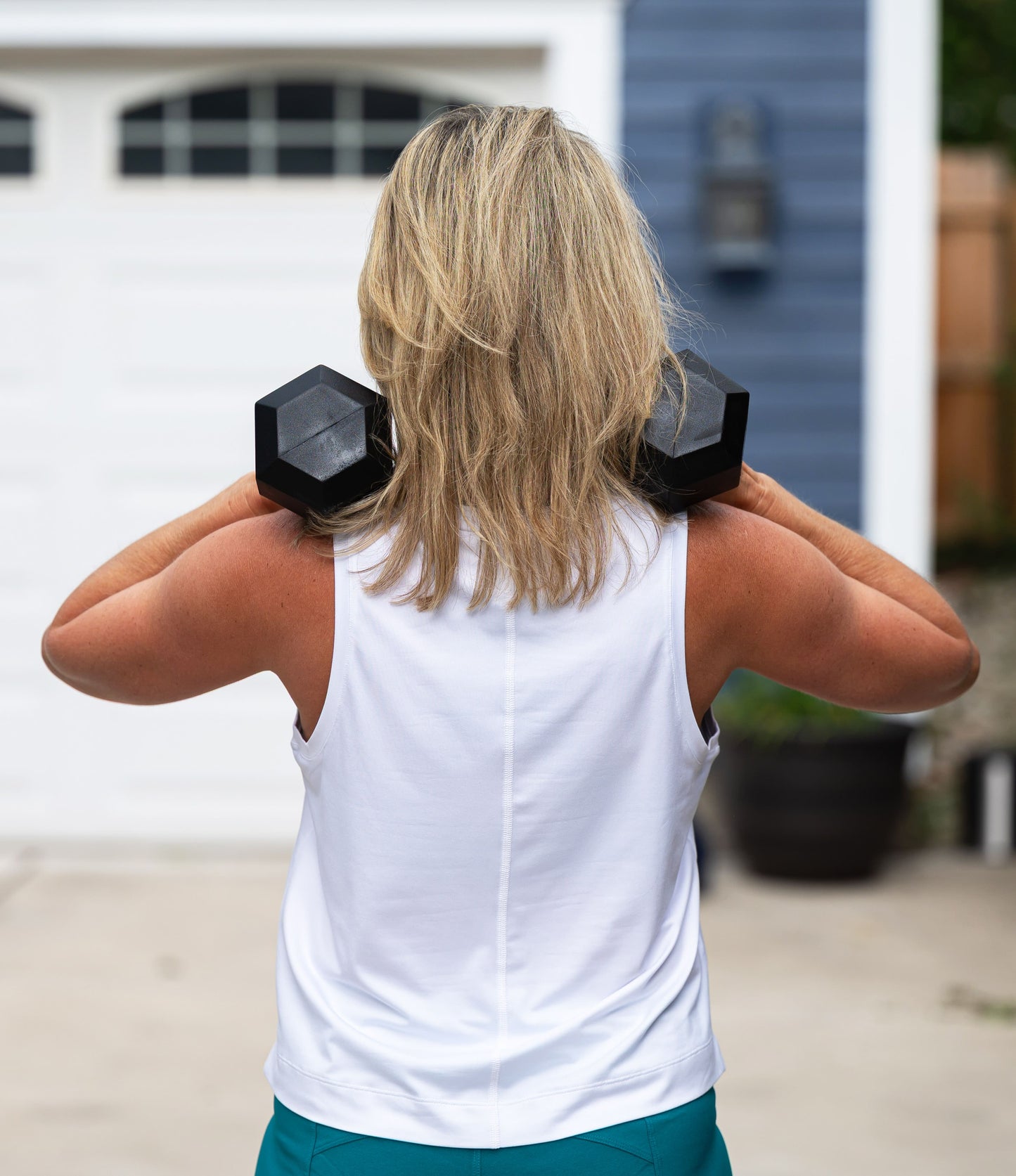 Dark grey Goal Five boxy crop tank top shown on a model, featuring a relaxed fit and sleeveless design.