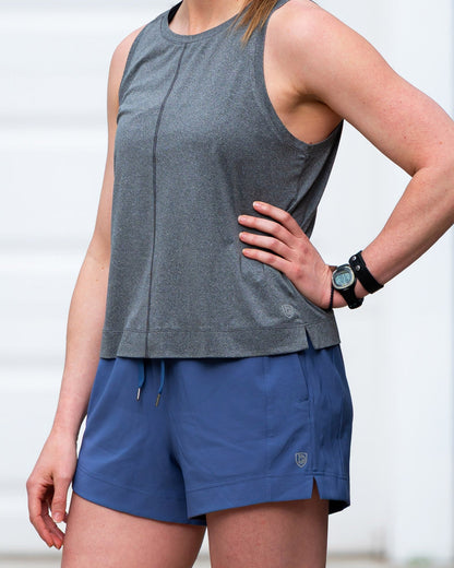 Dark grey Goal Five boxy crop tank top displayed on a mannequin, showcasing its relaxed fit and sleeveless design.