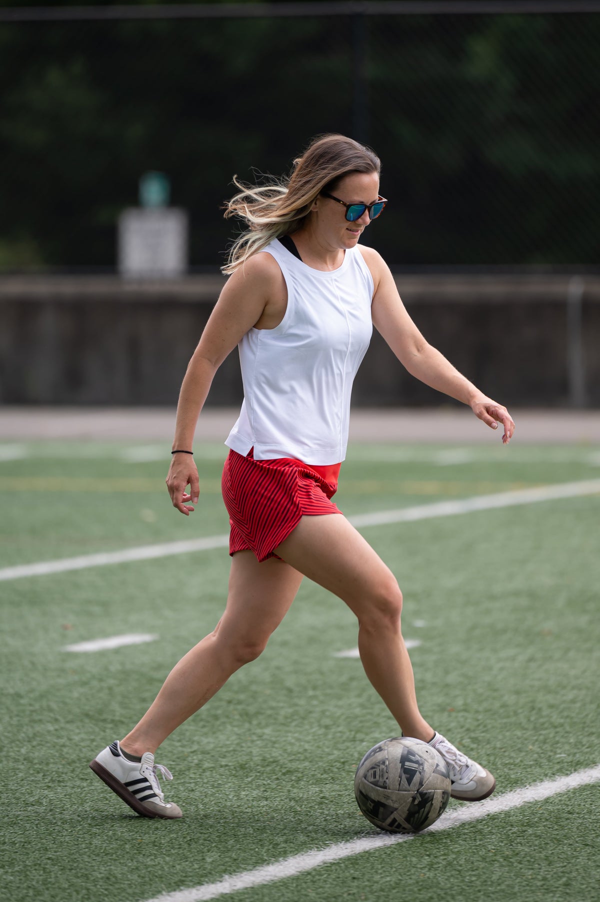Dark grey Goal Five boxy crop tank top displayed flat, showcasing its relaxed fit and sleeveless design.