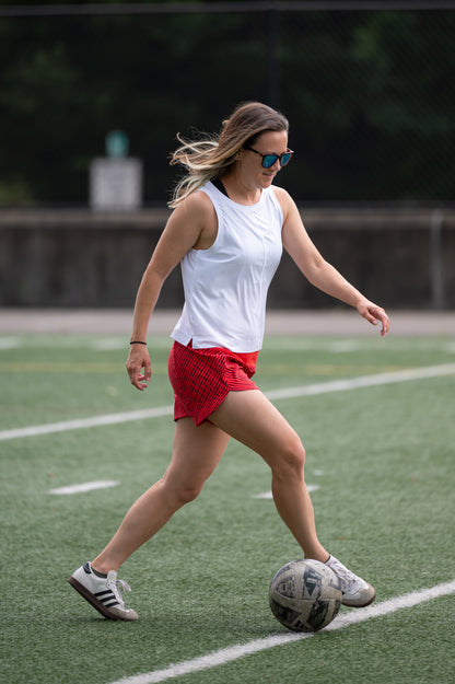 Dark grey Goal Five boxy crop tank top displayed flat, showcasing its relaxed fit and sleeveless design.