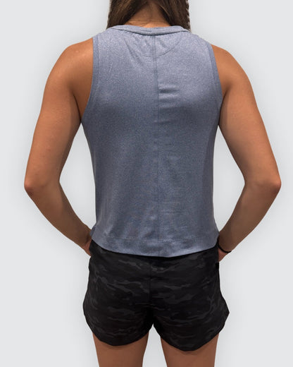 Dark grey Goal Five boxy crop tank top shown on a model, featuring a relaxed fit and sleeveless design.