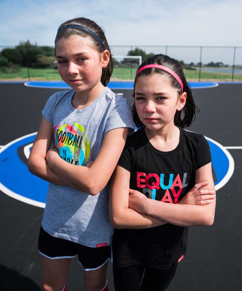 Equal Play girls' black T-shirt by Goal Five, featuring a comfortable lifestyle design for kids, shown on a girl model.
