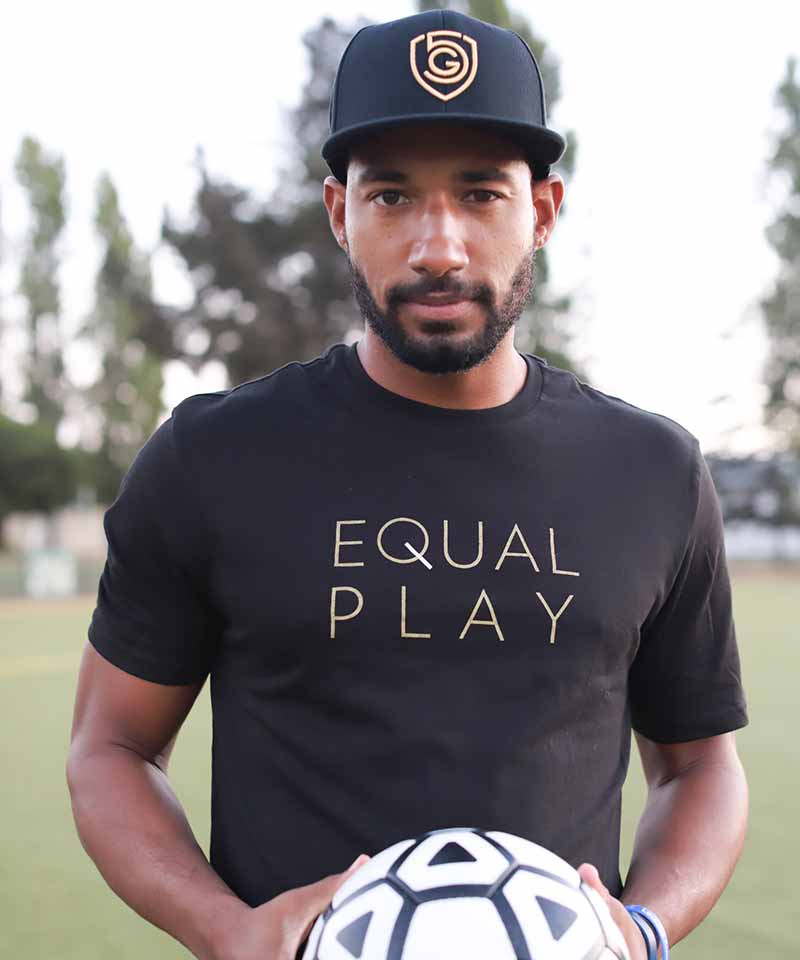 Black Equal Play men's athletic T-shirt by Goal Five, shown as a lifestyle image, highlighting comfortable fit and casual style.