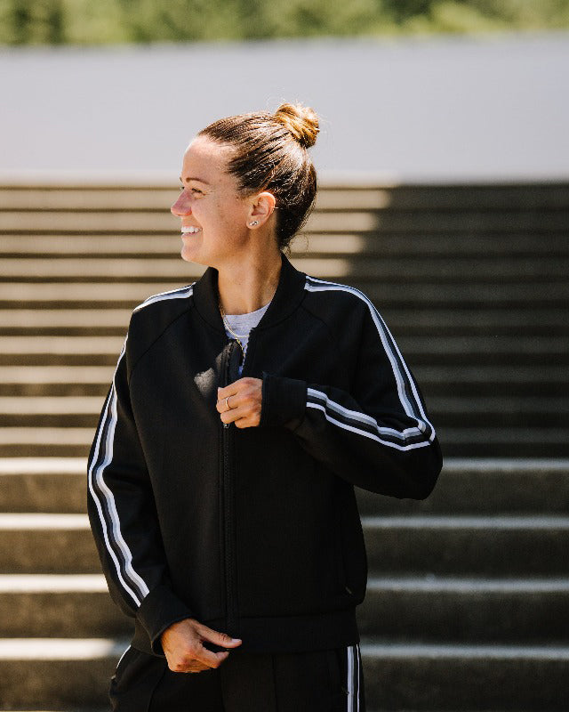 Black Goal Five Powerstripe LS Track Jacket, lifestyle style, shown on a model with a sporty, casual look.