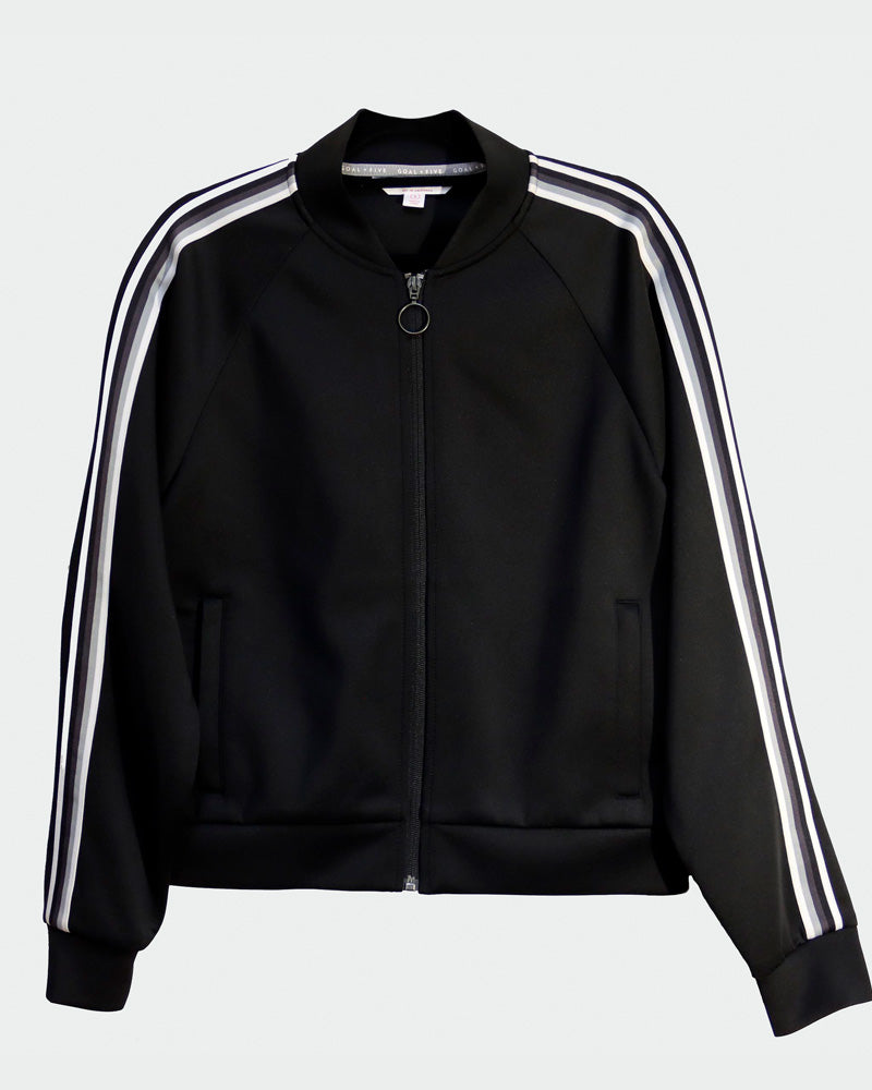 Goal Five Powerstripe LS Track Jacket in black, lifestyle image showing the athletic fit and stylish design.