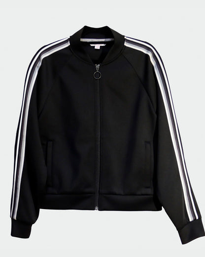 Goal Five Powerstripe LS Track Jacket in black, lifestyle image showing the athletic fit and stylish design.