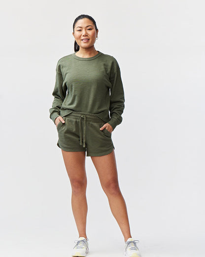 Goal Five Freasy Short in dark moss color, lifestyle image showing comfortable fit and casual style for athletic or leisure wear.