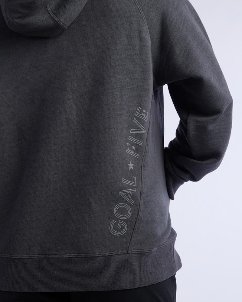 Dark teal Goal Five Freasy women's relaxed fit hoodie, lifestyle image showing front view and comfortable fit.