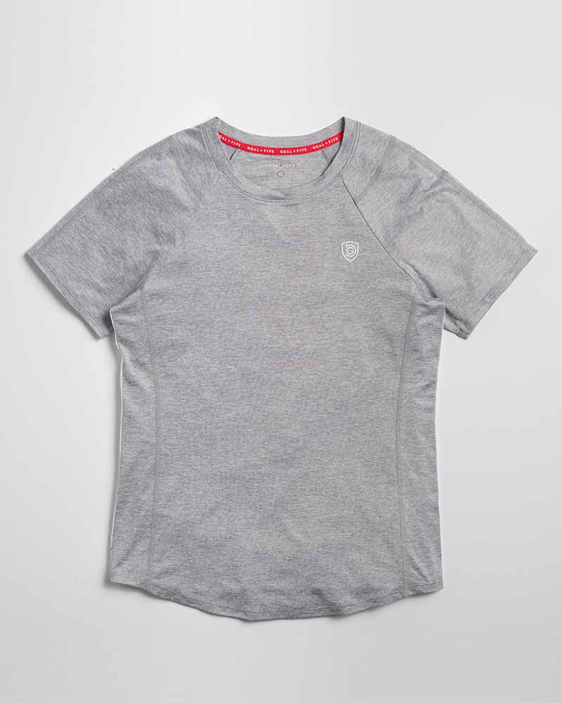 Advance Women's Training Top by Goal Five in ash heather, shown on a model, designed for comfortable activewear and workout sessions.