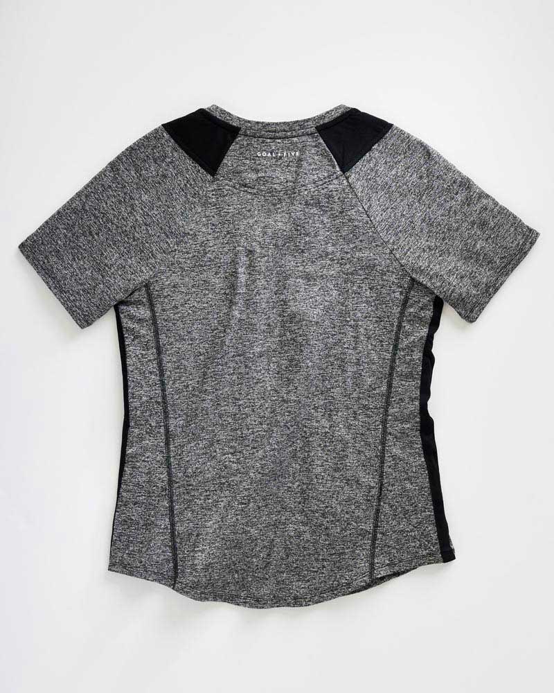 Advance Women's Training Top by Goal Five in ash heather, shown on a model, designed for active workout and training sessions.