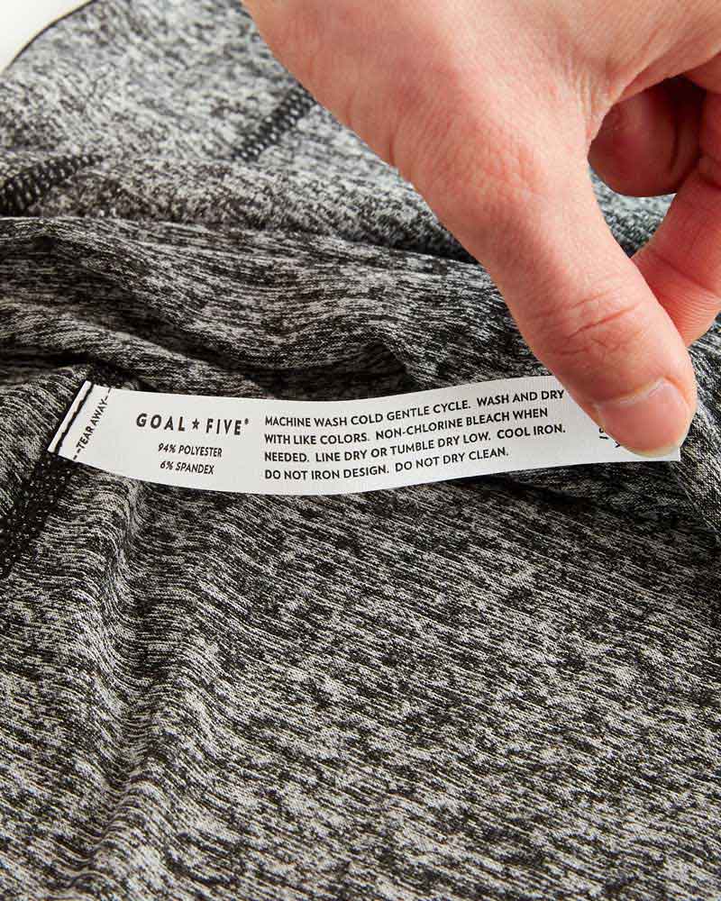 Advance Women's Training Top by Goal Five in ash heather, shown on a model, designed for comfortable athletic training.