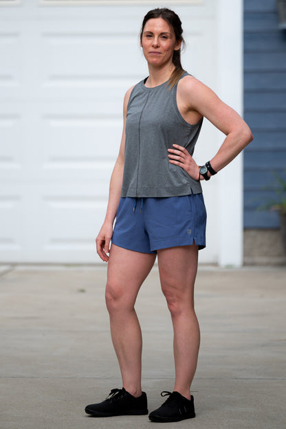 Black camo Goal Five Indie 2.0 women's training sport shorts laid flat, showing elastic waistband and lightweight fabric.