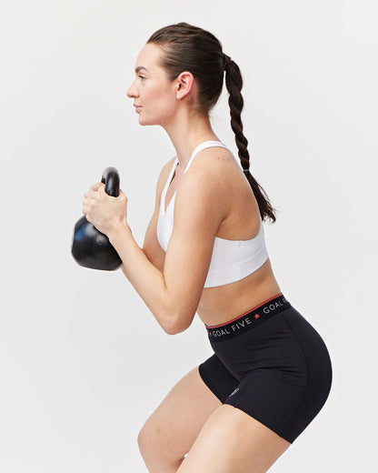 Goal Five women's black training Spandex shorts with elastic waistband and logo, suitable for workout and active wear.