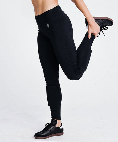Goal Five women's black training soccer tights with built-in shin guard pocket, designed for comfort and performance.