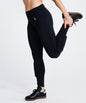 Goal Five women's black training soccer tights with built-in shin guard pocket, designed for comfort and performance.