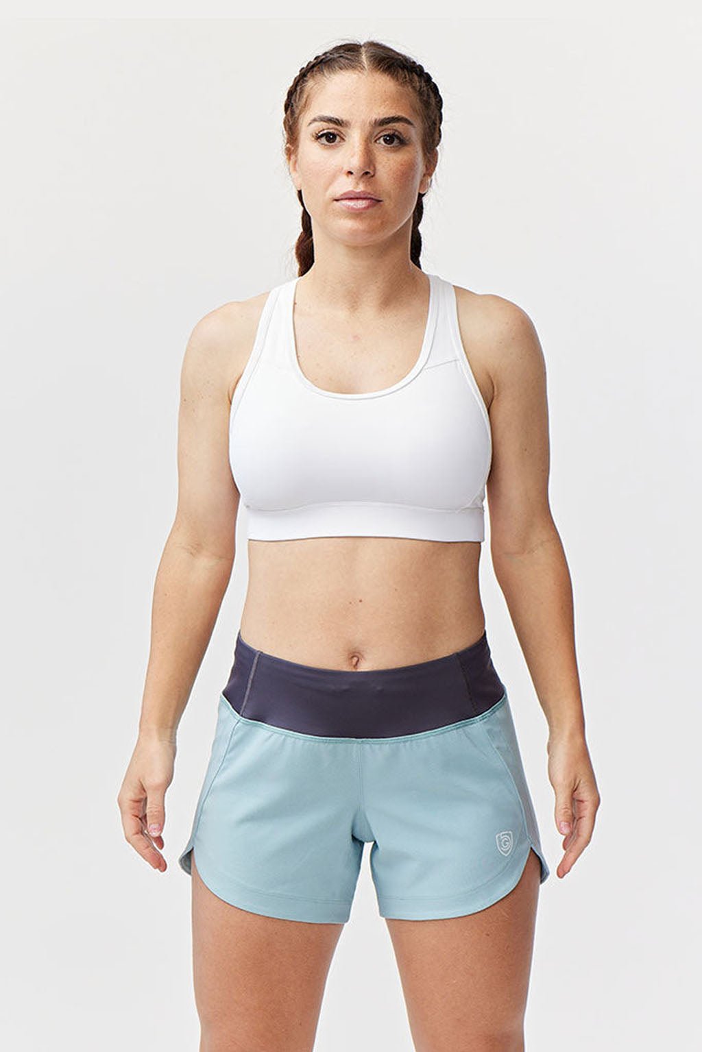 Black Excel women's workout shorts by Goal Five, designed for training, shown on a model in a fitness setting.