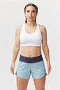 Black Excel women's workout shorts by Goal Five, designed for training, shown on a model in a fitness setting.