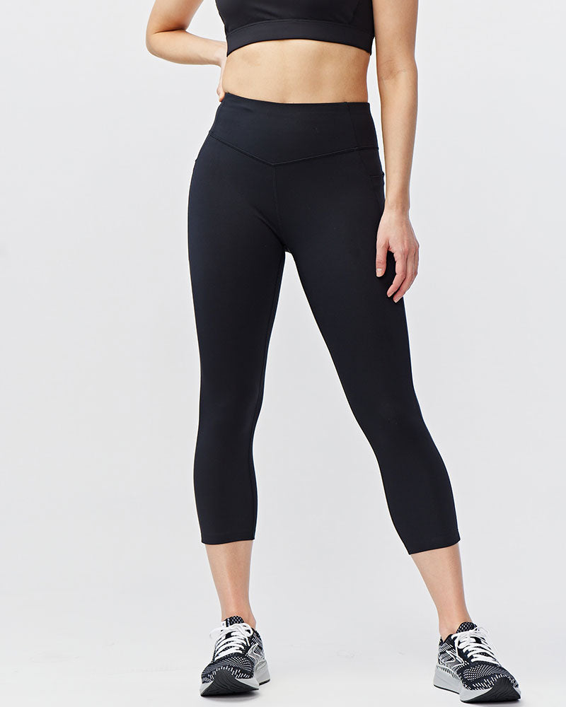 Black Goal Five women's cropped training leggings, 21-inch length, fitted and stretchy for active wear.